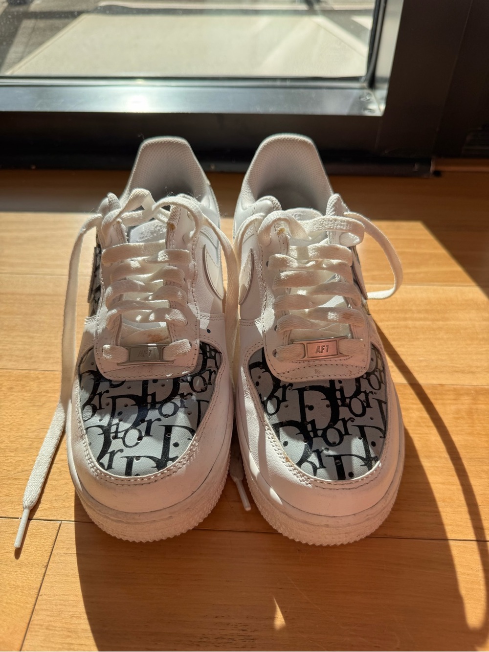 Nike White Sneakers with Black Monogram Toe